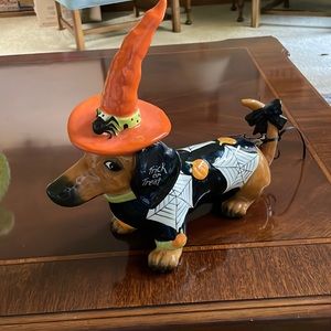 Blue sky clay works Halloween dachshund.